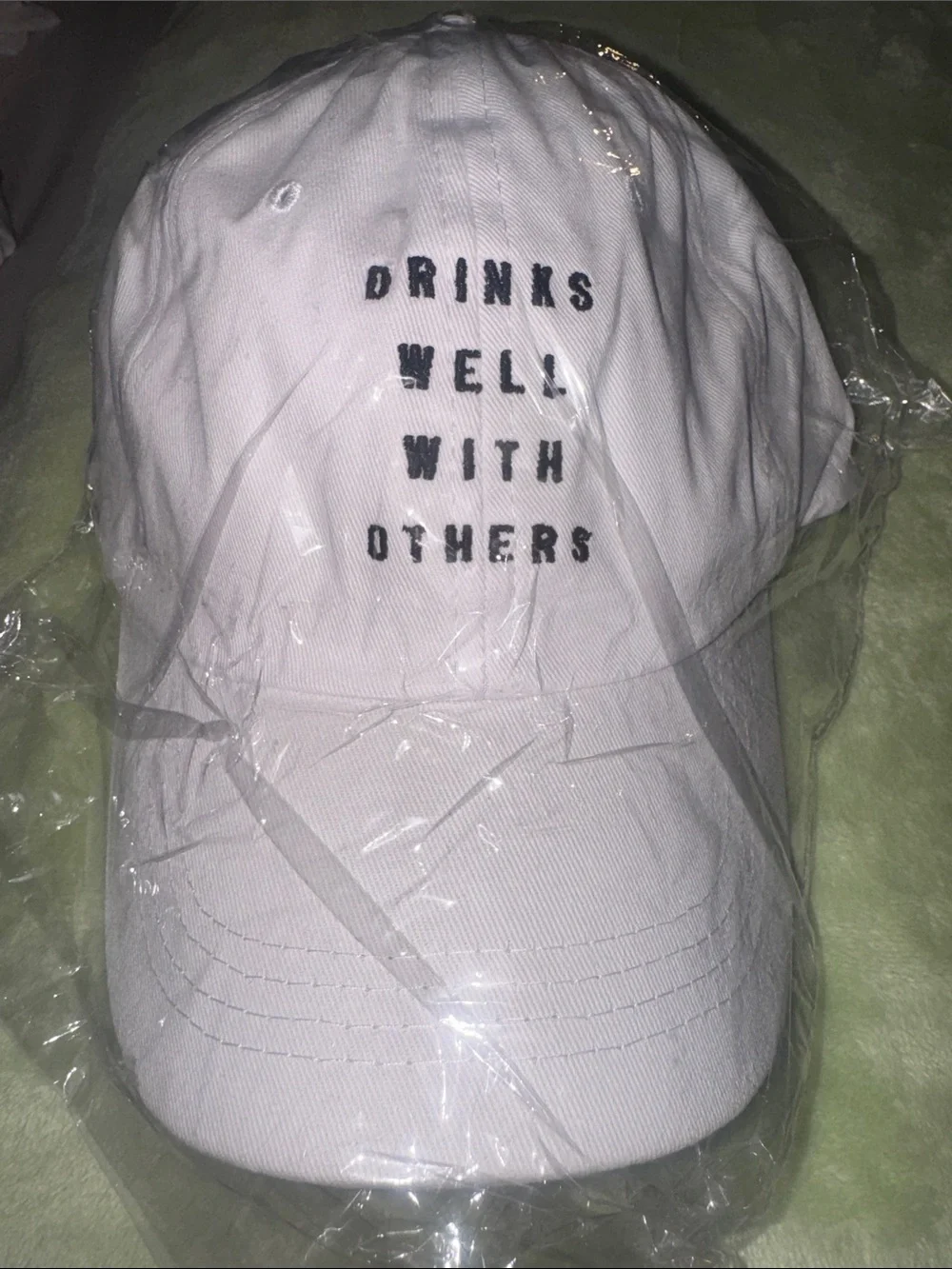 SHEIN NWT Adjustable Cap with “Drinks Well With Others” Text